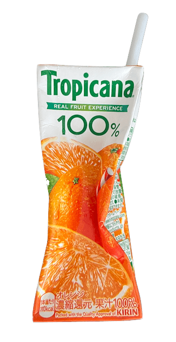 An empty Tropicana carton, drained and crumpled, straw still in it